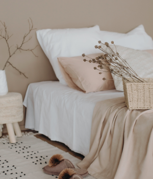 Neutral-toned bedroom with cozy decor and natural elements, creating a calm and peaceful space.